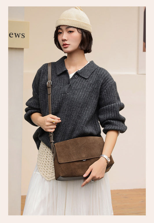 Back view of a caramel suede shoulder bag worn crossbody