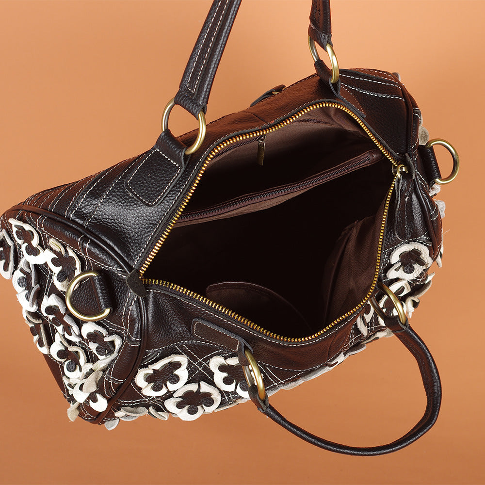 Open black and white Boston bag showing interior pockets