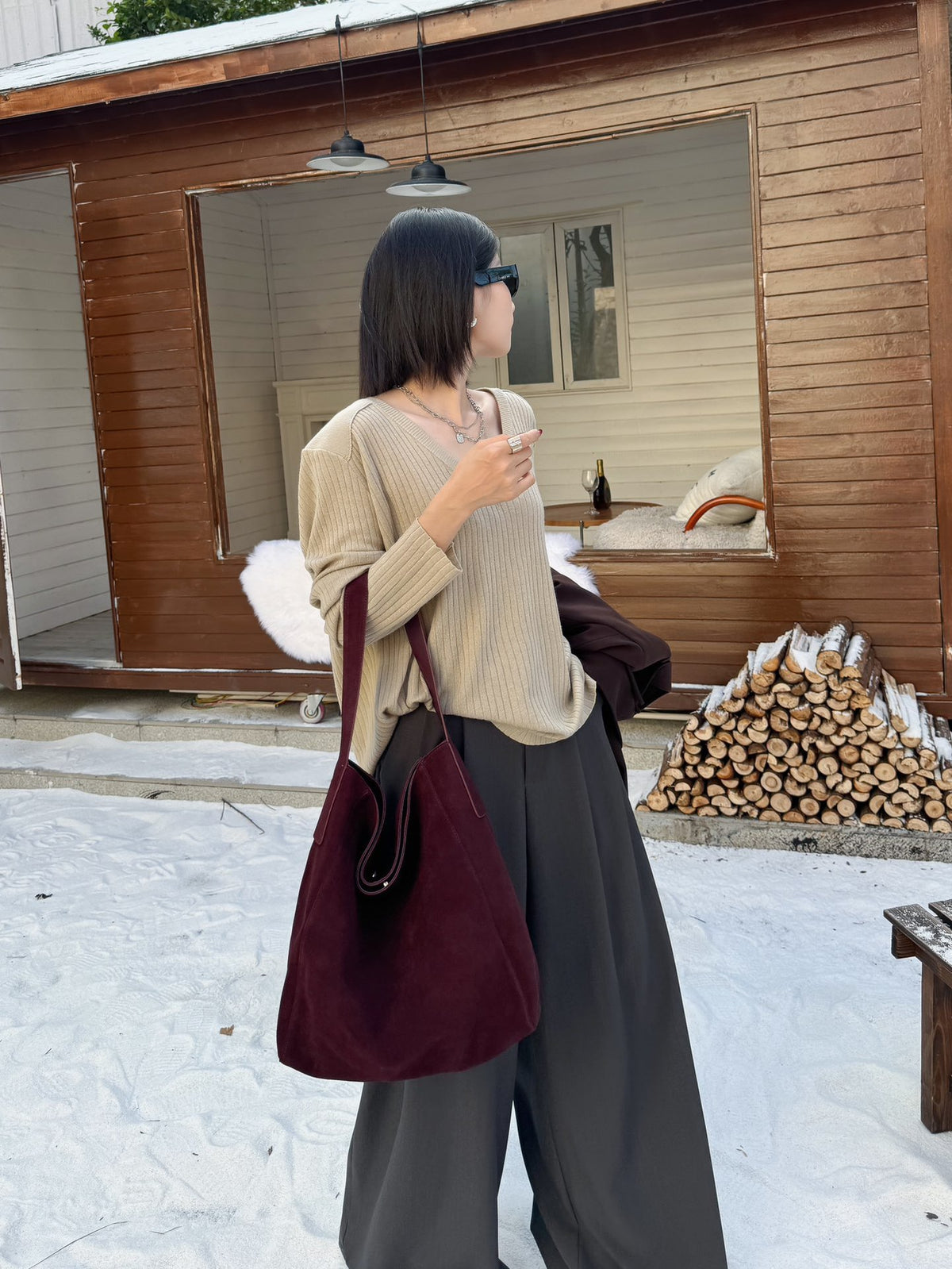 Back view of the burgundy bag worn over the shoulder