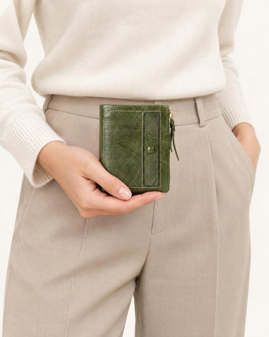 Top-Grain Cowhide Vintage Vertical Short Wallet held in hand by a model