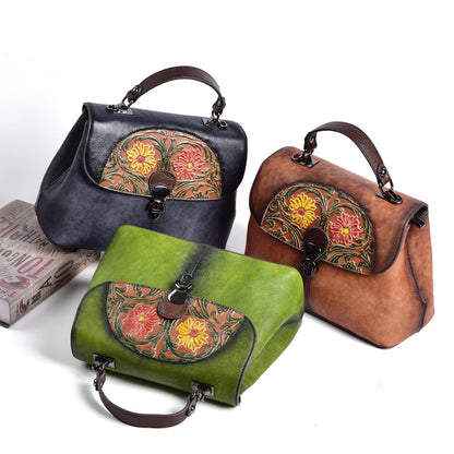 Green, brown, and black floral leather bags shown together