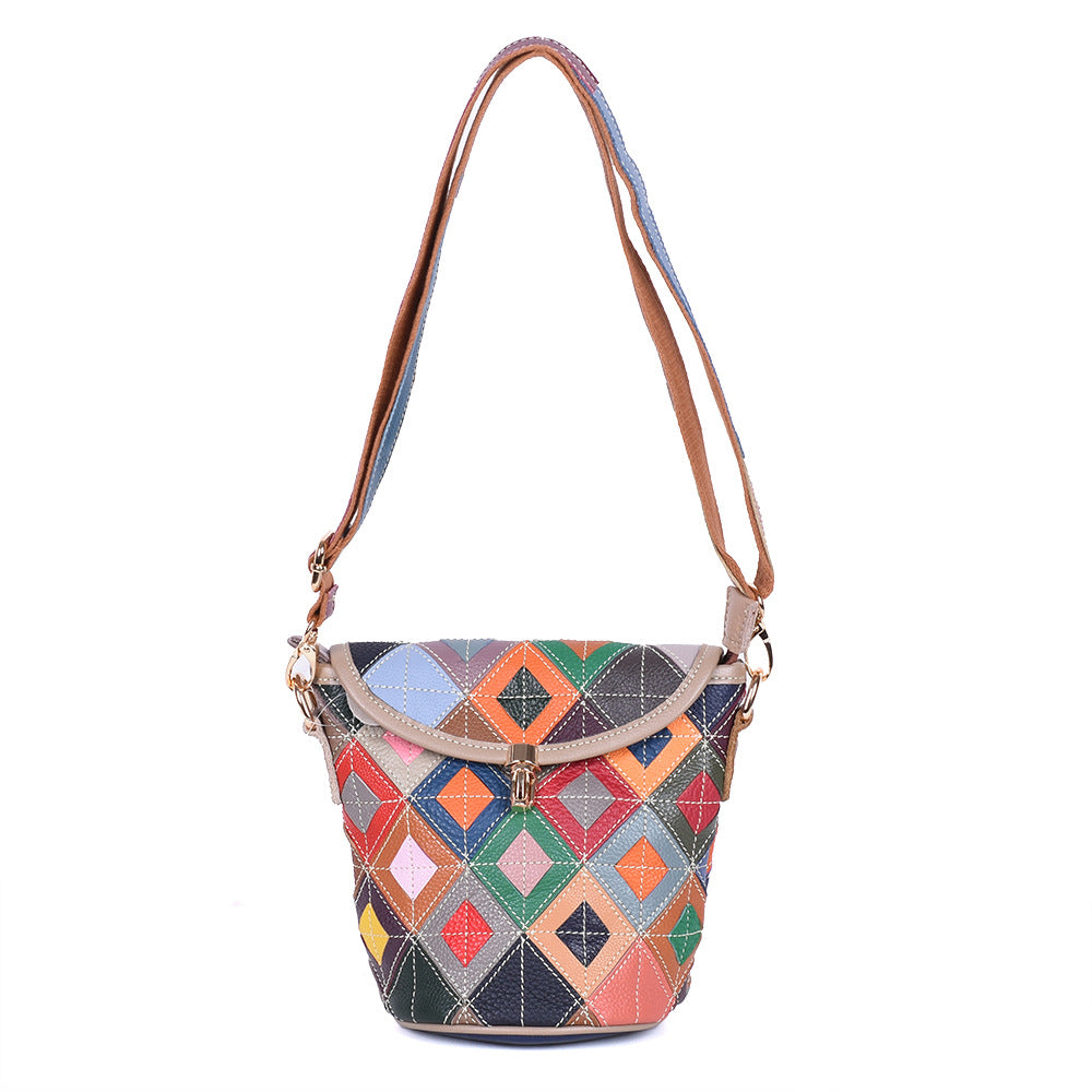 Portrait view of colorful patchwork flap bag with shoulder strap