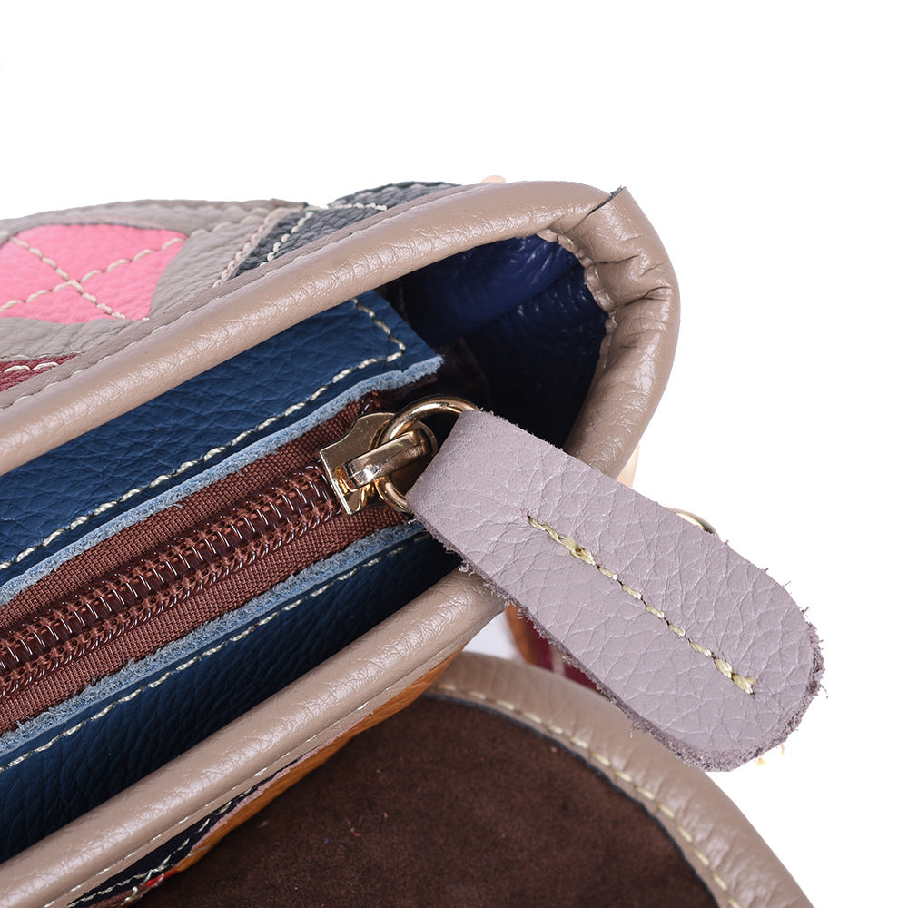 Close-up of the bag's zip pocket and leather trim