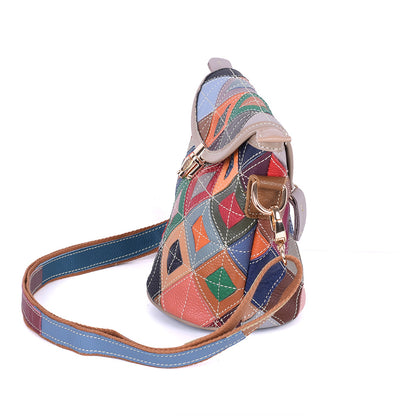 Side profile of geometric cowhide bag and attached strap