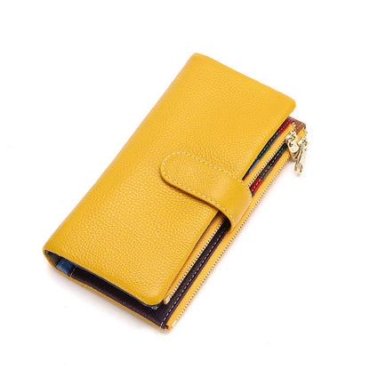 Yellow genuine leather long phone wallet with gold-tone zipper on white background