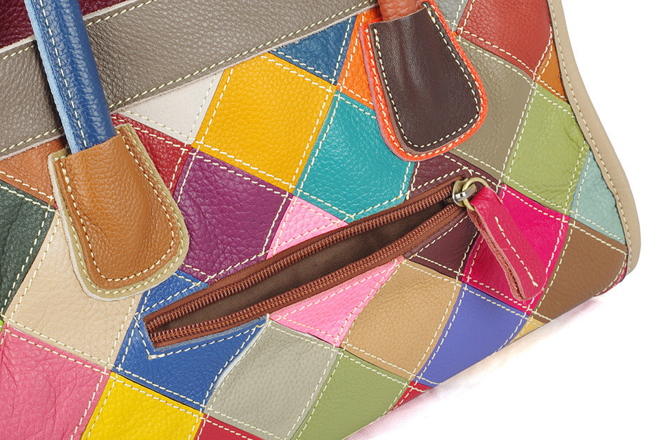 Close-up of the exterior zip pocket and stitched patchwork