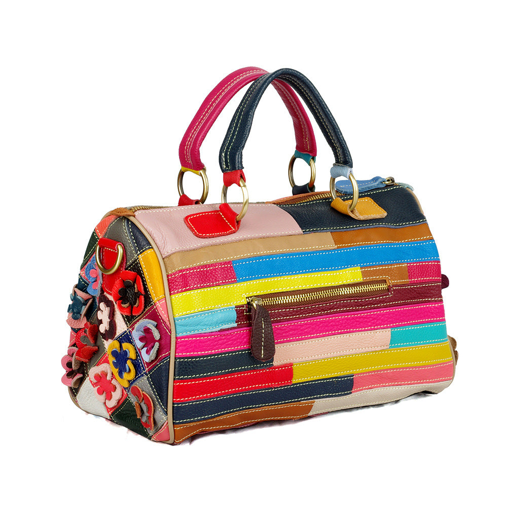Back view of multicolor striped patchwork Boston bag