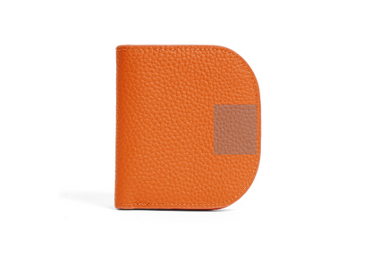 Closed orange pebbled cowhide leather bifold wallet with snap closure detail