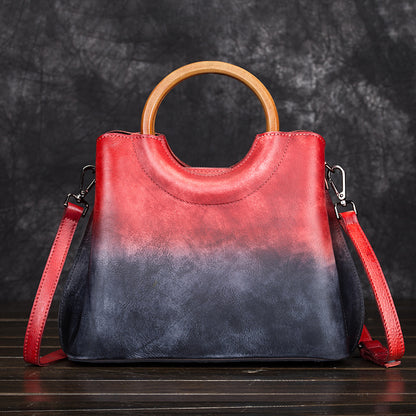 Front view of red and dark blue vintage leather crossbody handbag