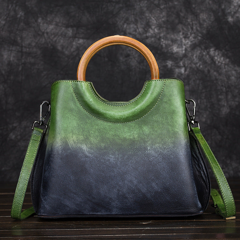 Green and dark blue colorblock leather crossbody bag with top handle