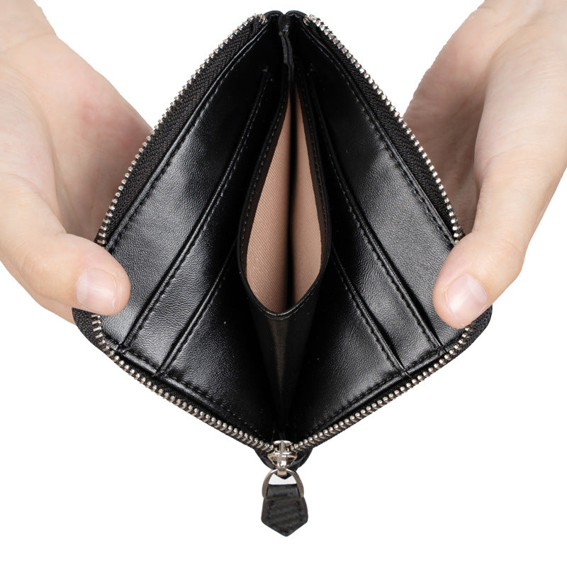 Black leather short wallet opened to show eight card slots and bill pockets