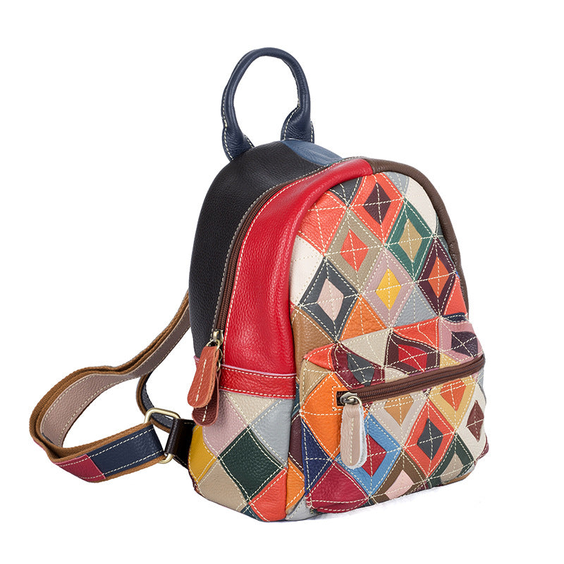 Front three-quarter view of colorful cowhide patchwork backpack