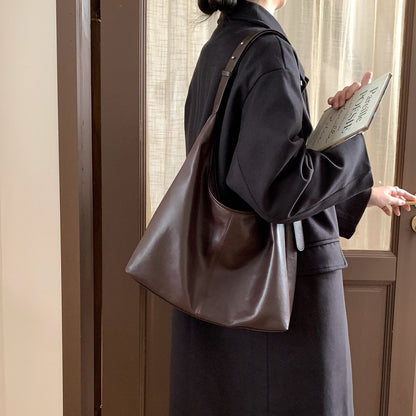 Ebony brown shoulder tote carried on the shoulder