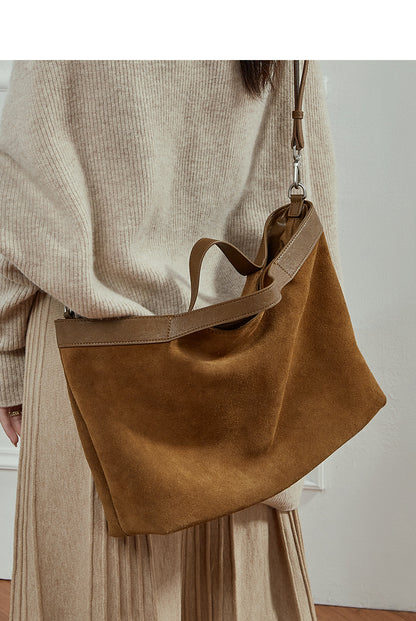 Back and bottom view of rectangular leather handbag in brown color