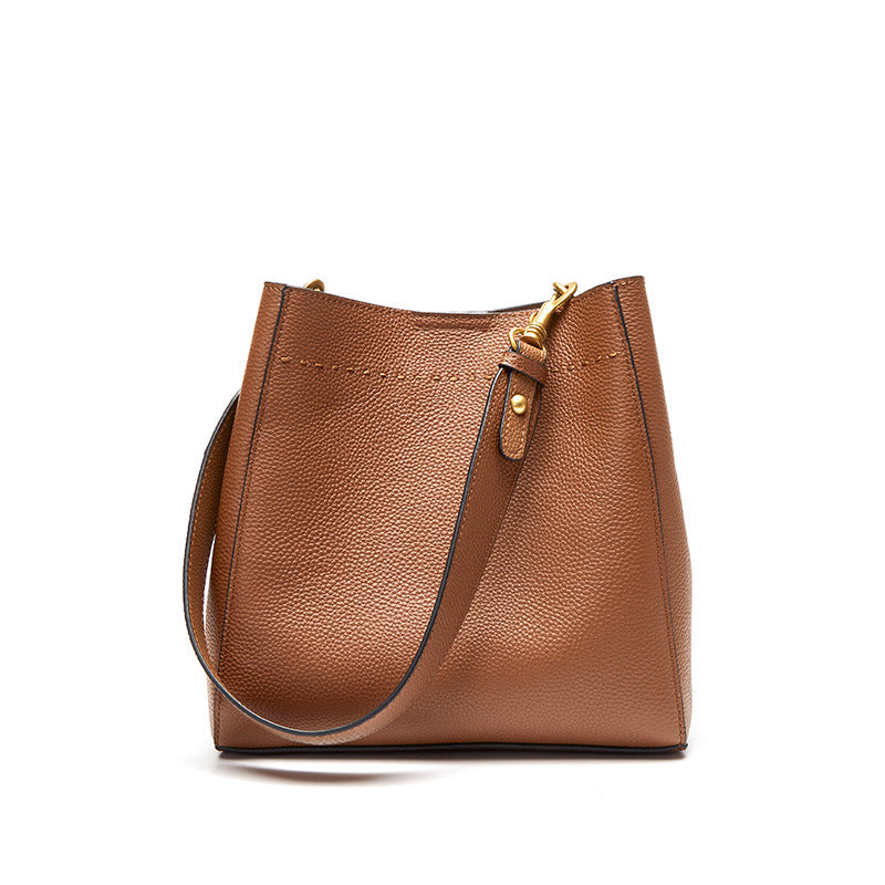 Tan cowhide leather bucket tote bag with gold-tone hardware