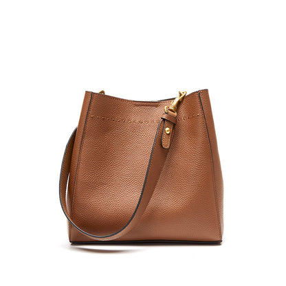 Tan cowhide leather bucket tote bag with gold-tone hardware