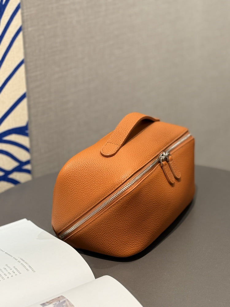 Orange-brown cosmetic pouch shown from the front