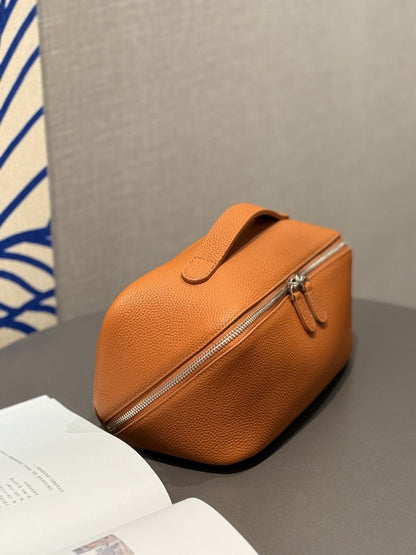 Orange-brown cosmetic pouch shown from the front