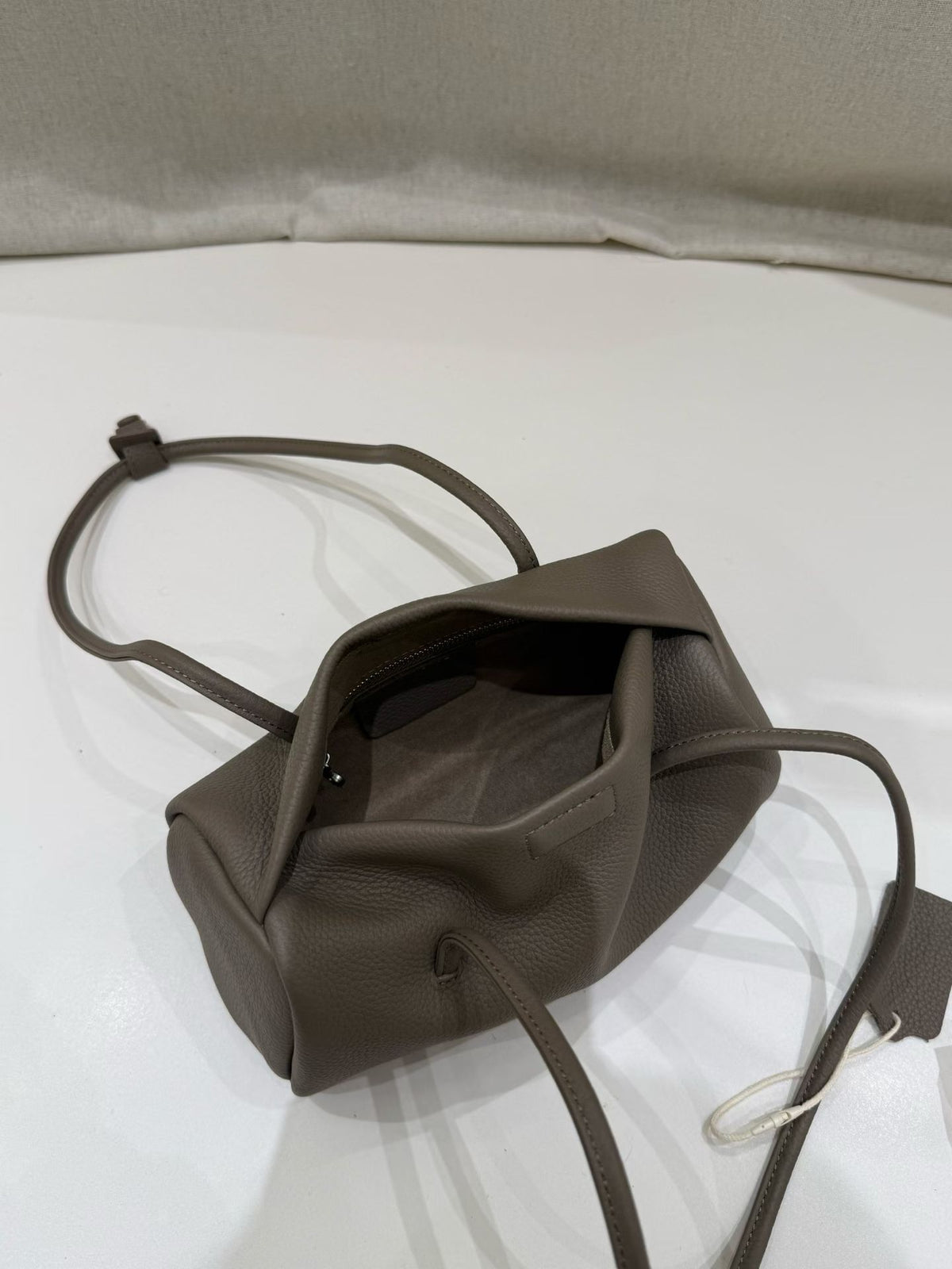 Open elephant gray bag displaying its interior pocket
