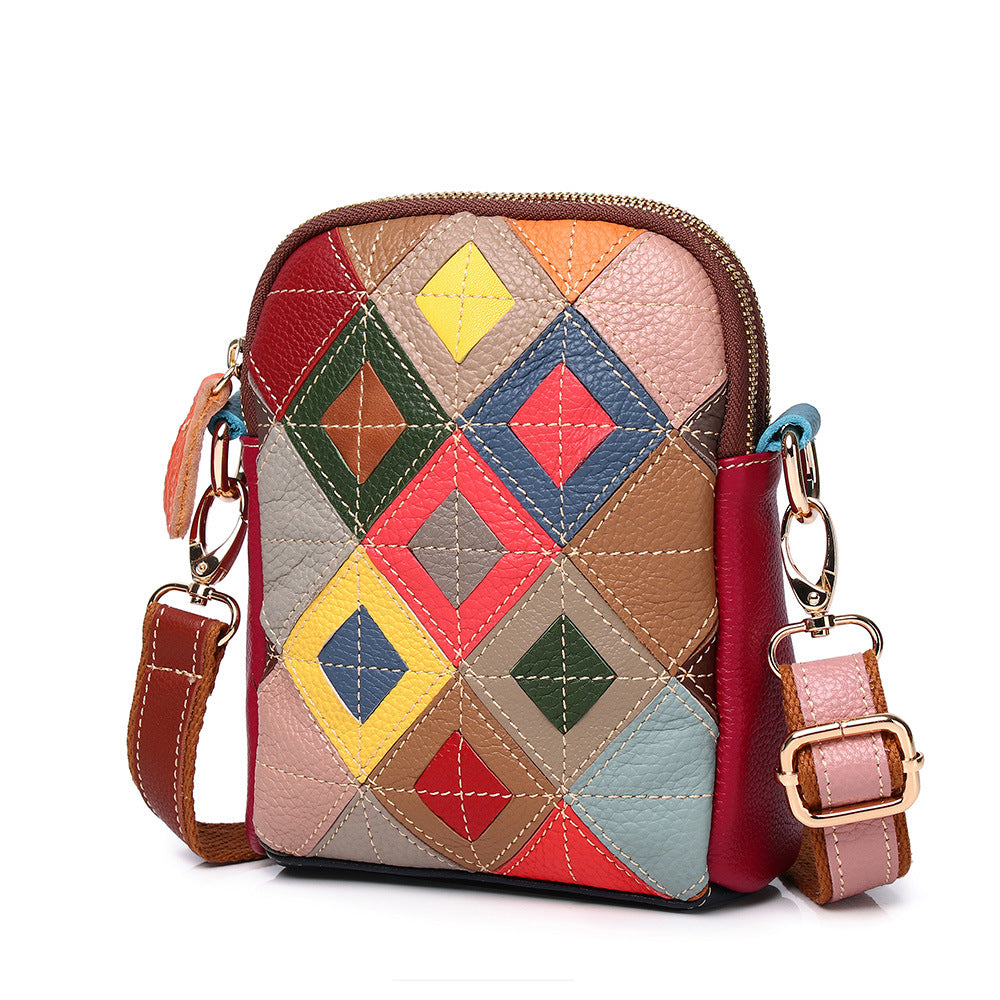 Front view of multicolor geometric patchwork cowhide shoulder bag
