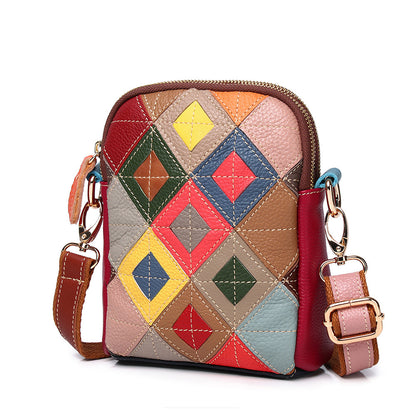 Front view of multicolor geometric patchwork cowhide shoulder bag