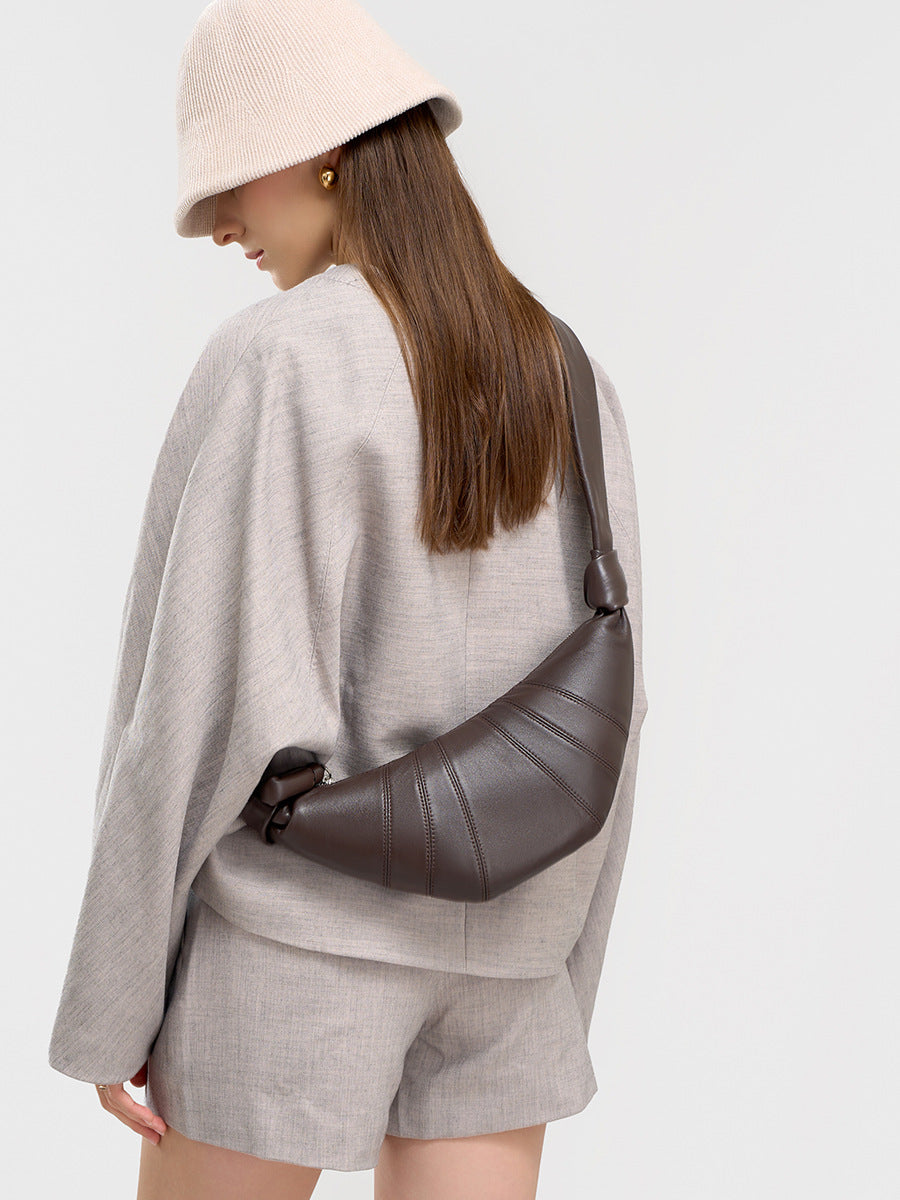 Back view of model with coffee crescent bag worn as crossbody