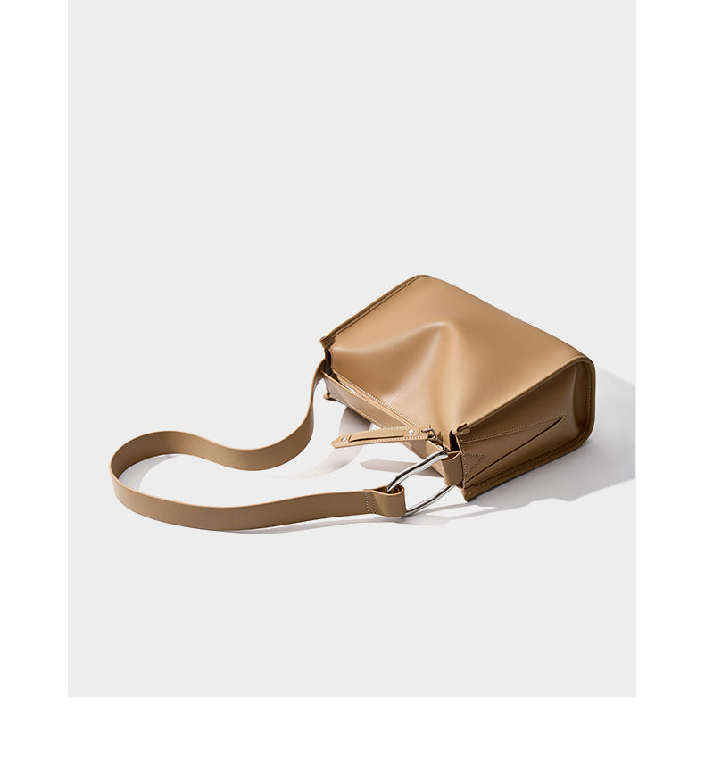 Apricot pillow bag lying flat showing strap and hardware