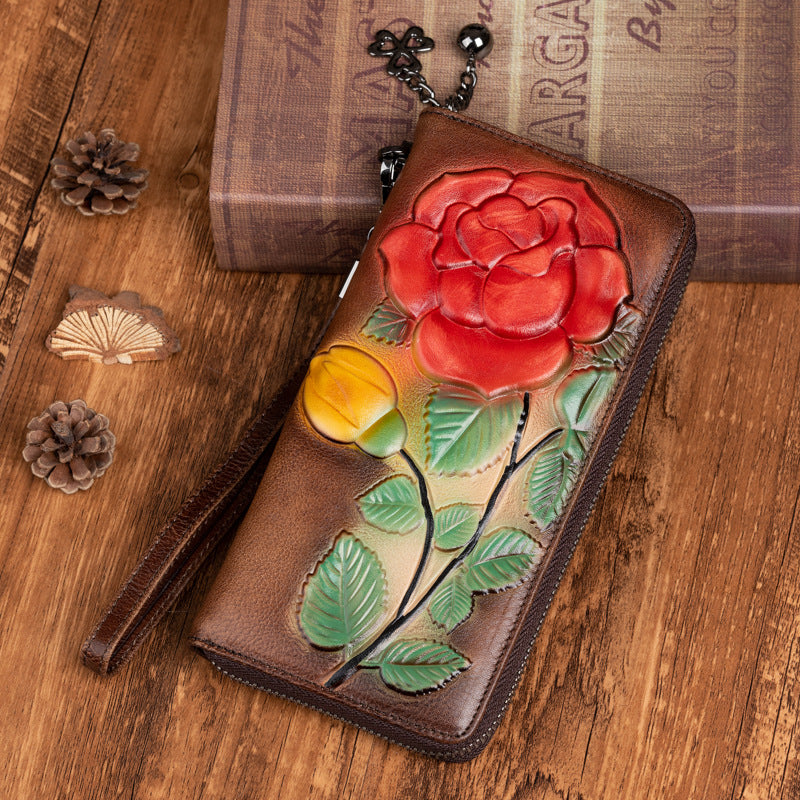 Vintage coffee wallet showing embossed red flower and green leaves