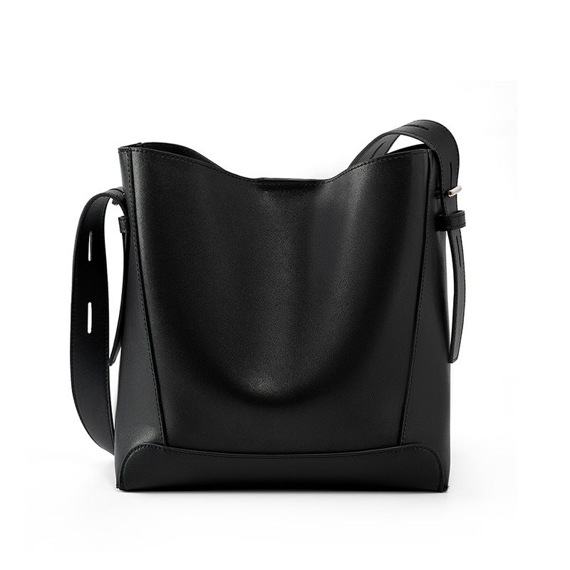 Black leather bucket bag on white background