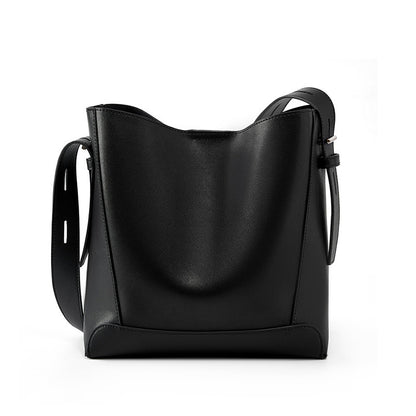 Black leather bucket bag on white background