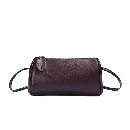 Black top-grain cowhide mini barrel bag side profile
