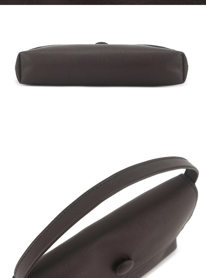 Side profile showing the bag's slim depth and shoulder strap