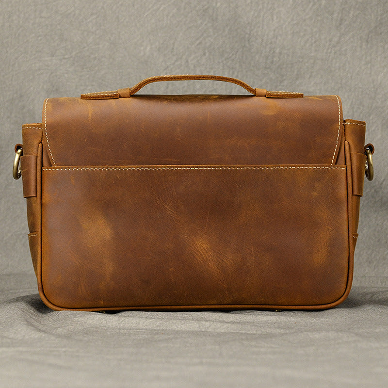 Rear exterior view of brown leather camera bag
