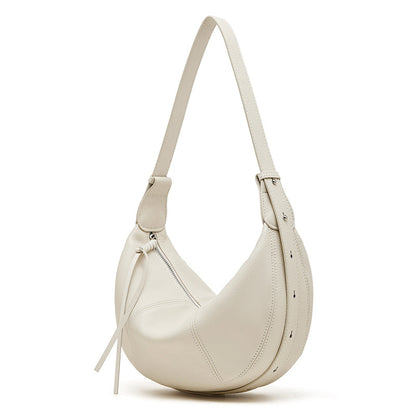 Pearl white pebble leather hobo bag on white background