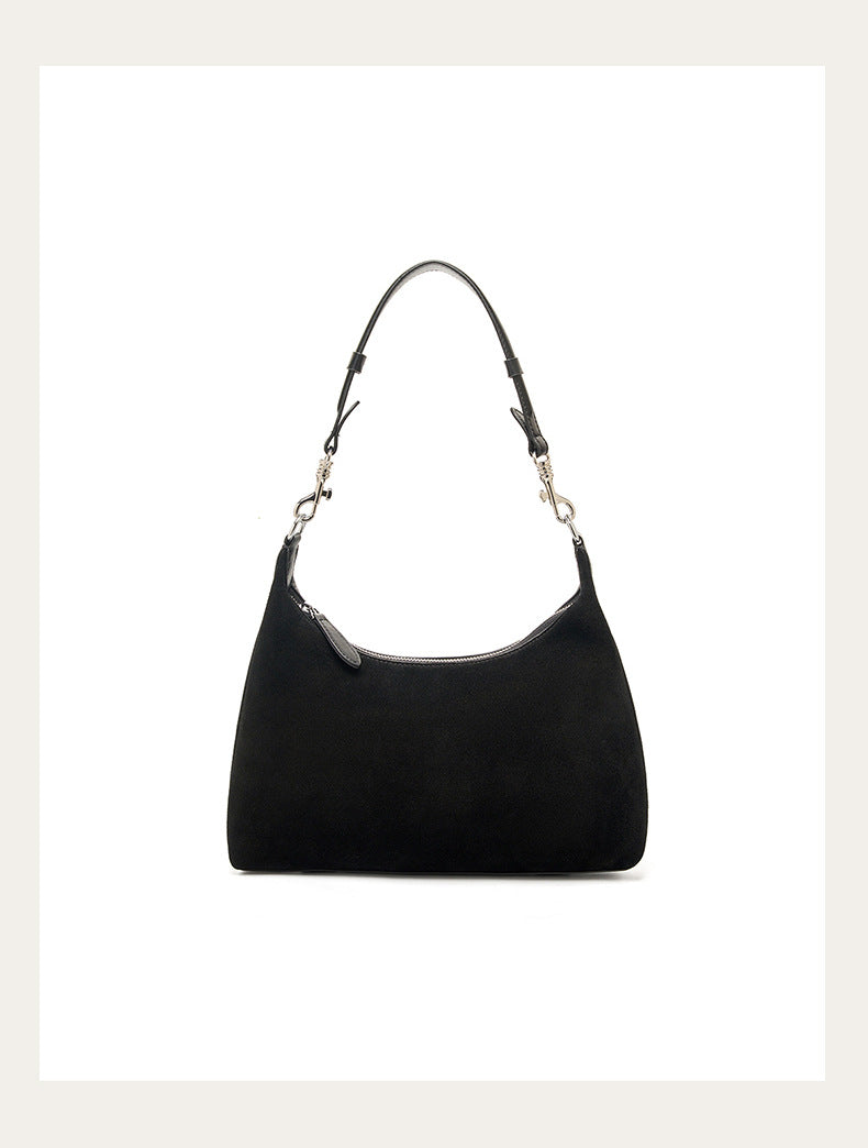 Black shoulder bag shown against a light background