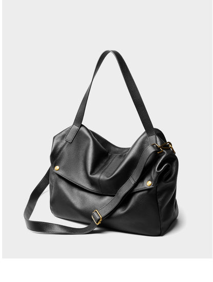 Front view of black pebbled leather tote with antique brass hardware