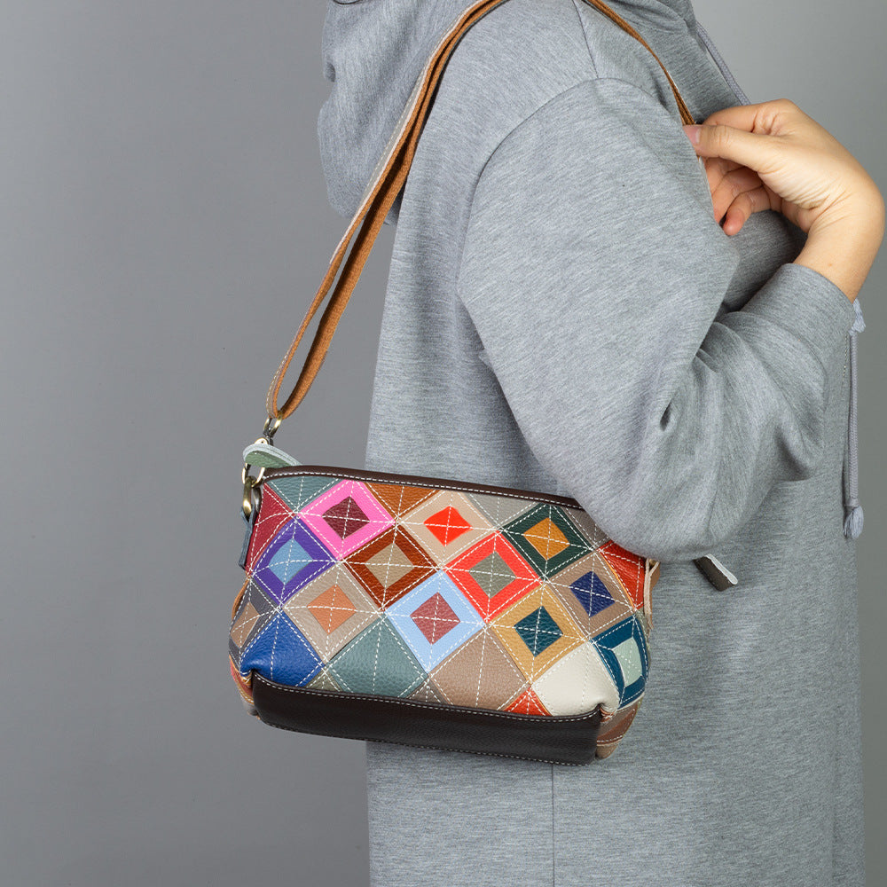 Patchwork shoulder bag shown worn across the body