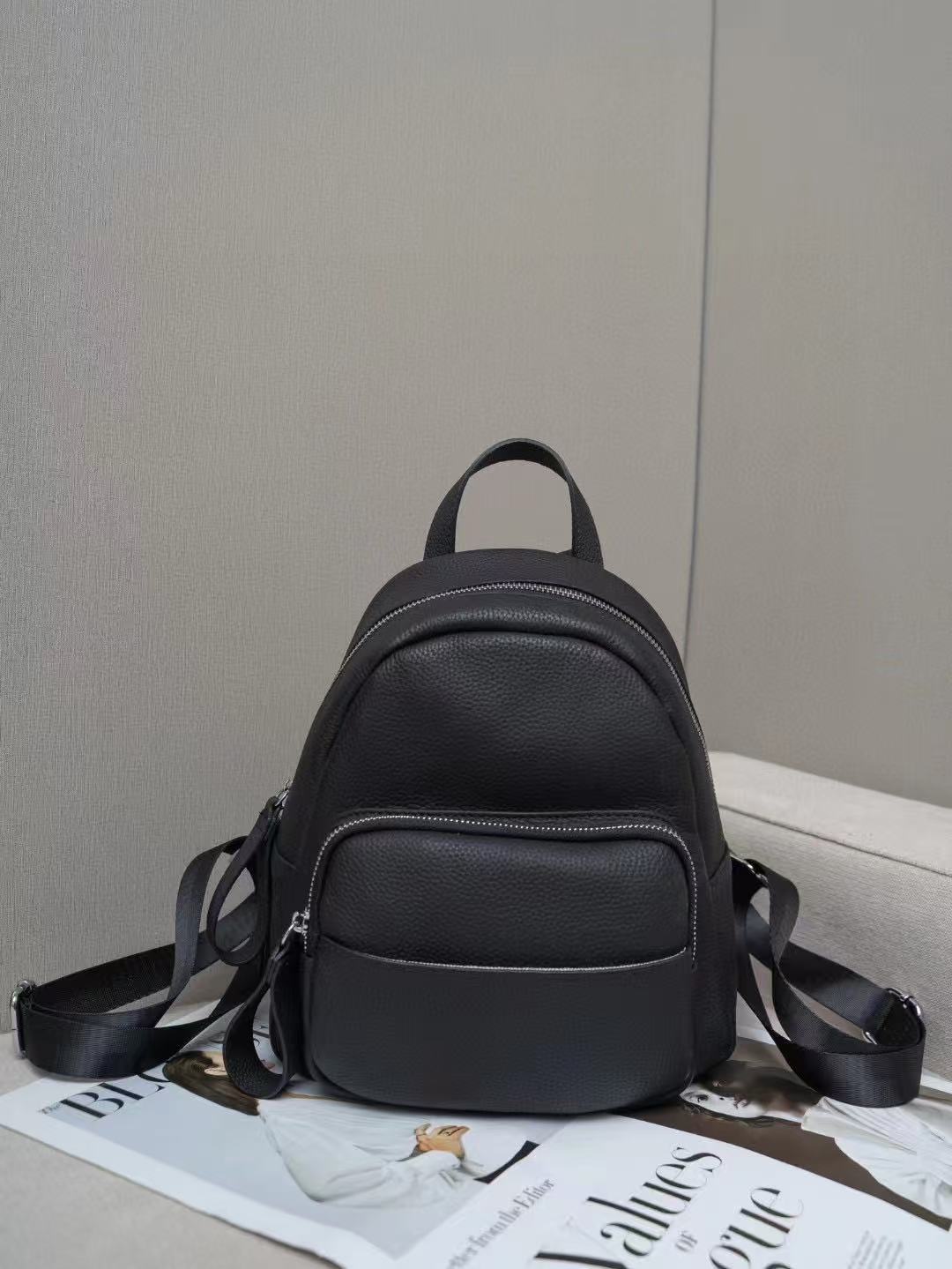 Black pebbled leather mini backpack shown from the front