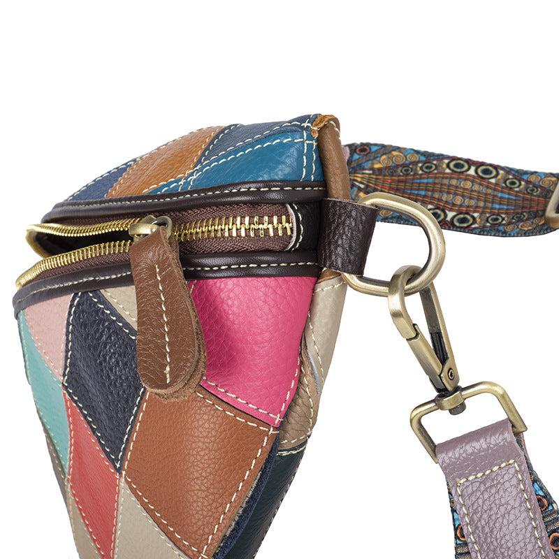 Close-up of bag side, zipper, and metal strap attachment