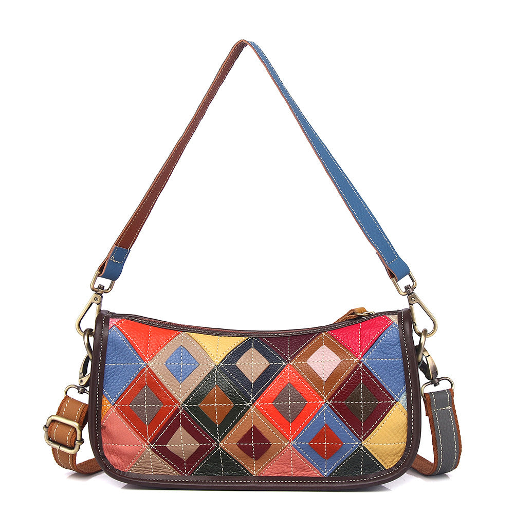 Front view of multicolor geometric patchwork cowhide shoulder bag with long strap