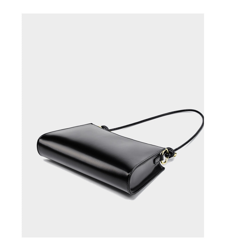 Black leather shoulder bag viewed from above showing structured silhouette
