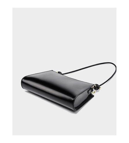 Black leather shoulder bag viewed from above showing structured silhouette