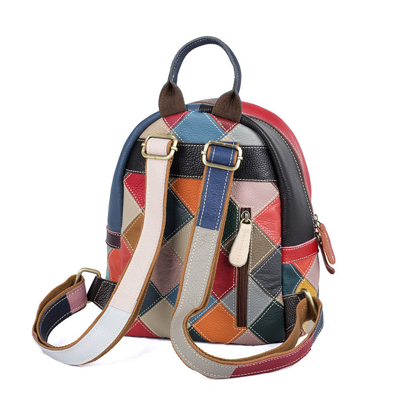 Back view showing patchwork panels, shoulder straps, and top handle