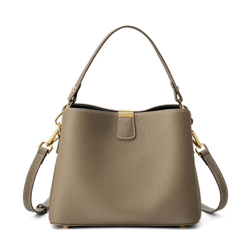 Gray pebbled leather bucket bag on white background