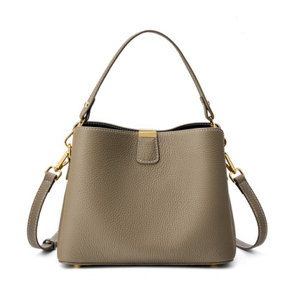 Gray pebbled leather bucket bag on white background
