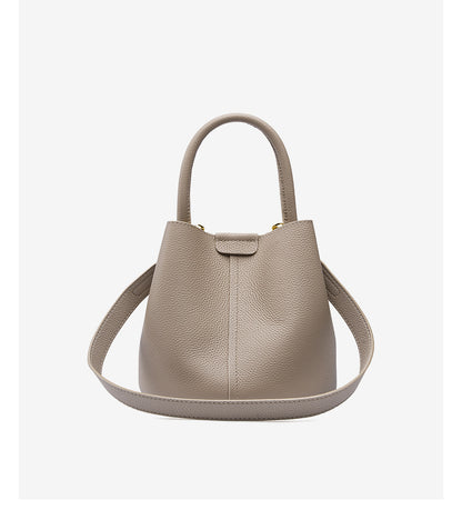 Milk tea bucket bag front view showing top handle and adjustable strap