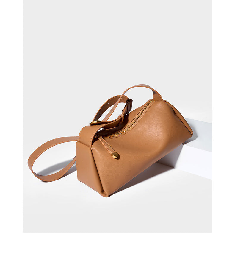 Apricot pillow crossbody bag top-down view showing zip closure