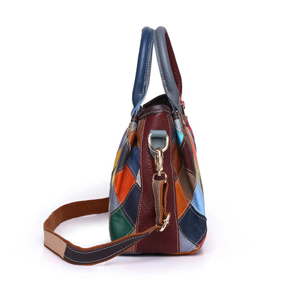 Side profile showing the bag depth, top handles, and detachable shoulder strap