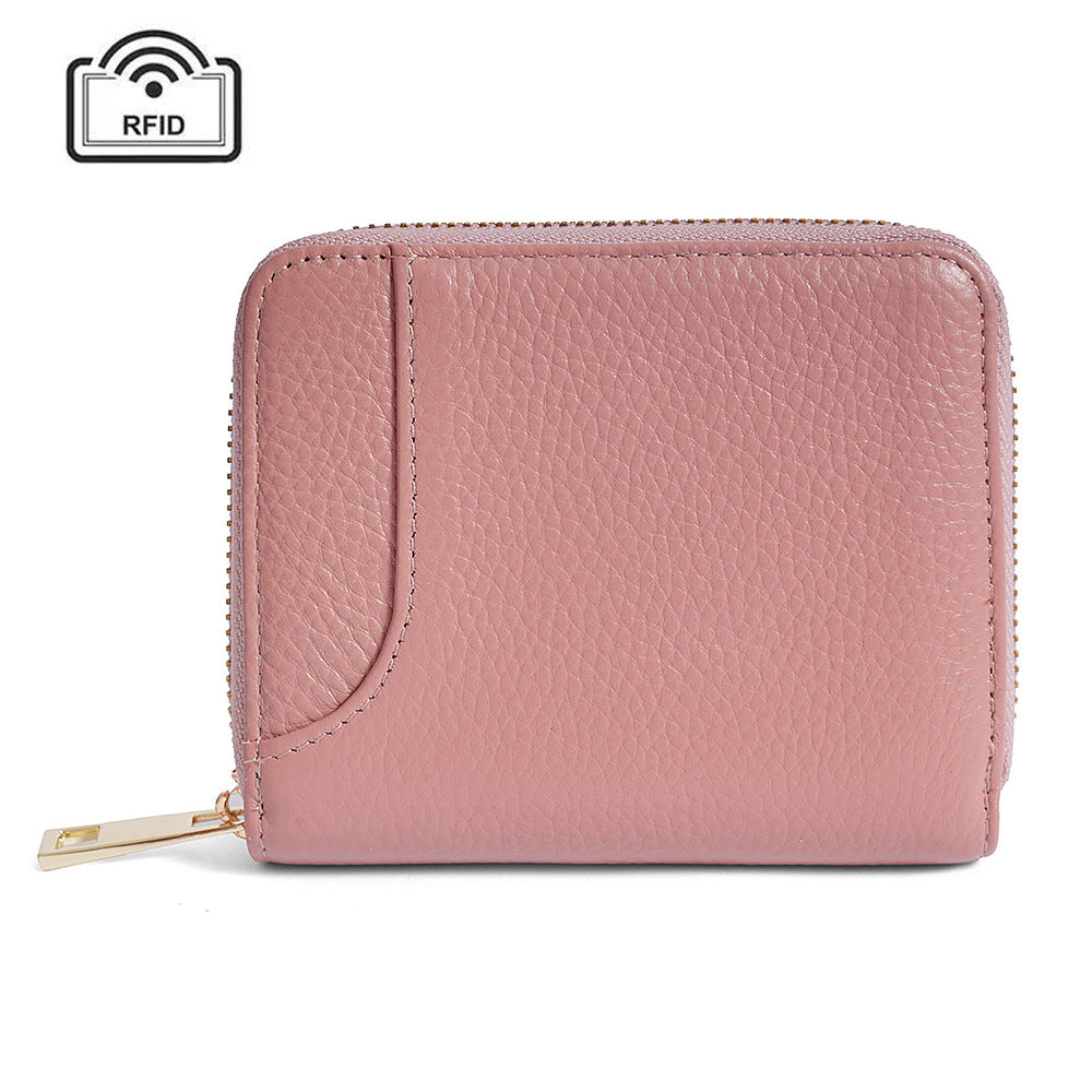 Pink pebbled cowhide RFID zip wallet with gold-tone hardware, front view