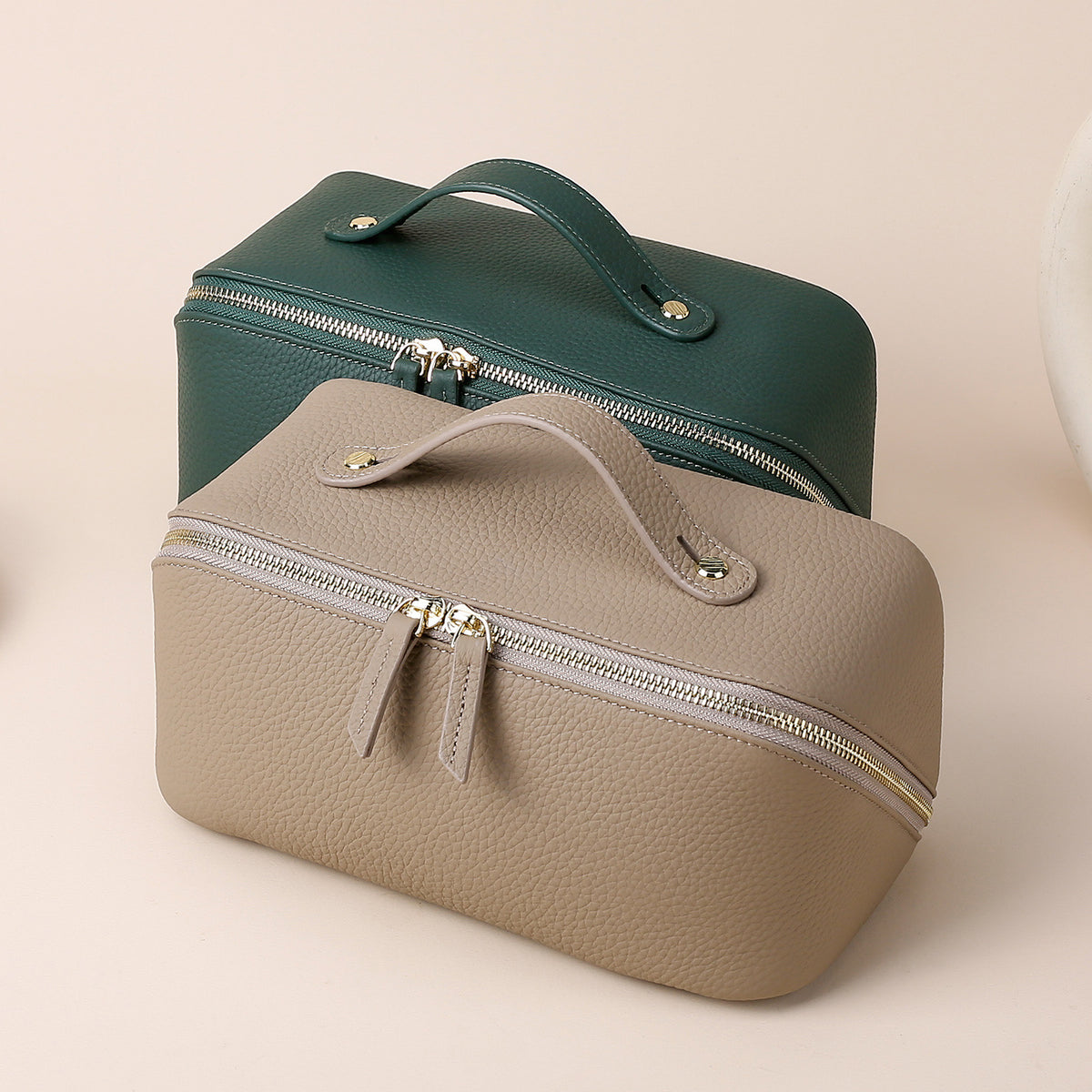 Dark green cosmetic pouch with carry handle and double zipper